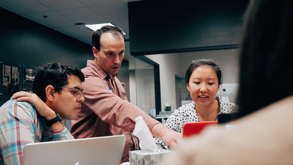 DIG Developer Helping Students at a Hackathon