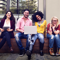 Smiling people sitting on a bench