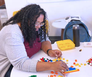 SaLauren Budde demonstrating stackability with legos