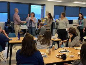 Academic Innovation staff raffling off items for United Way raffle