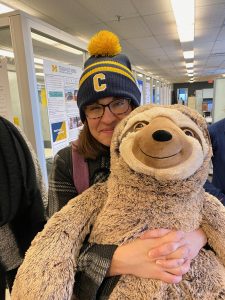 Jen Vetter with stuffed animal sloth