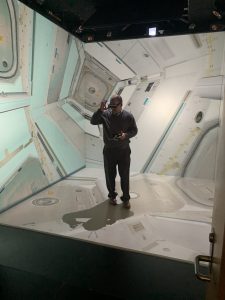 James Hilton is exploring the International Space Station in the MiDEN, a 10 x 10 x 10 foot immersive audio-visual environment that offers 3D stereoscopic projections.
