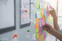 designer workshopping an idea on a board