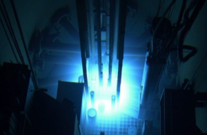 (Illustration of a nuclear reactor, glowing blue.)