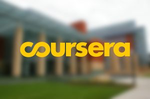 coursera logo overlaid on blurred image of Michigan campus