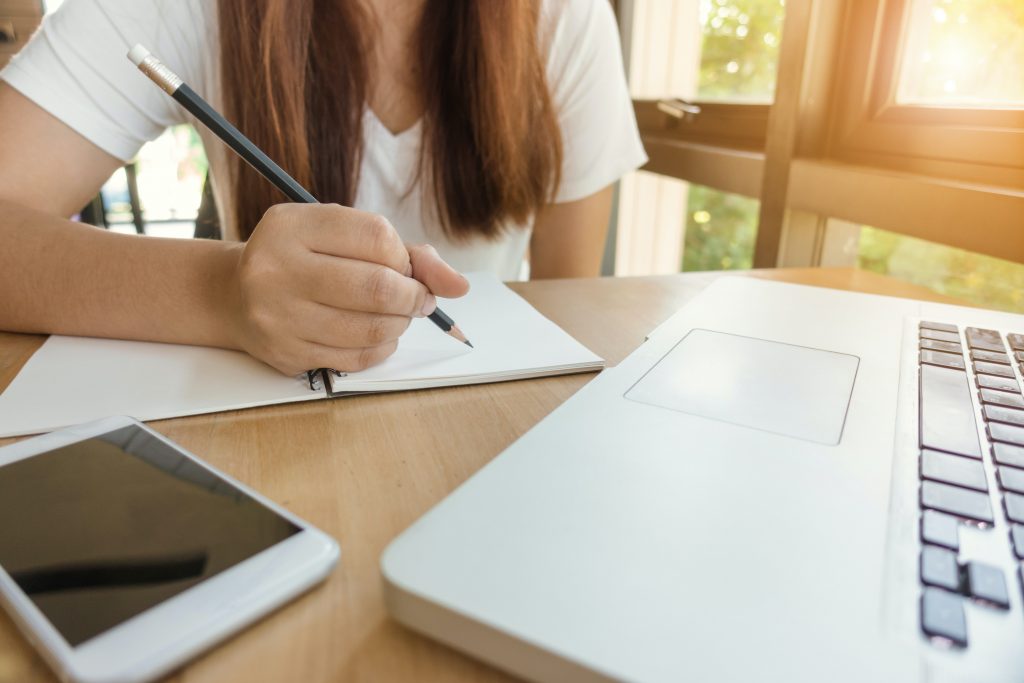 woman taking notes