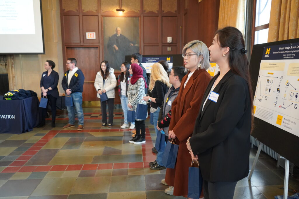 People standing side by side in front of a room