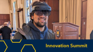 Man with Hololens headset on and photo has a label of "Innovation Summit"