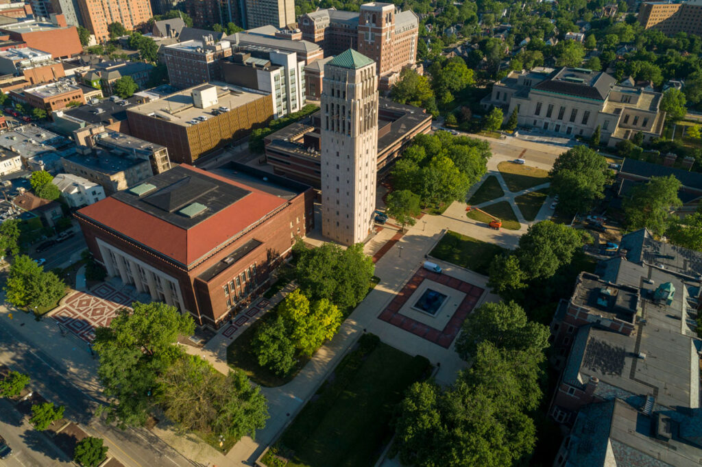 Aerial view of several campus buildings and greenspace.