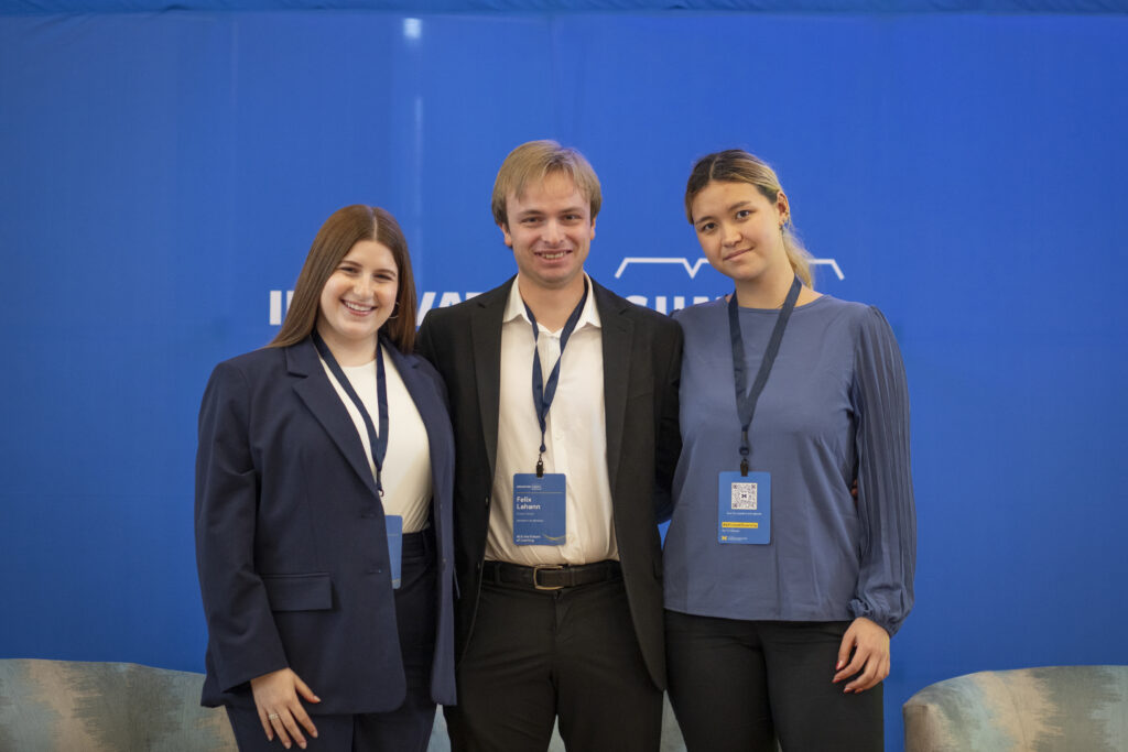 Three students posing for a photo together. 